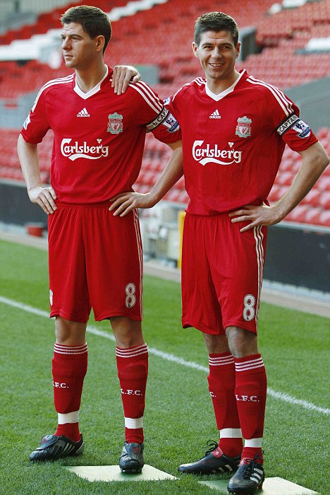 Liverpool captain Gerrard smiles as he comes face to face with his wax figure in Liverpool